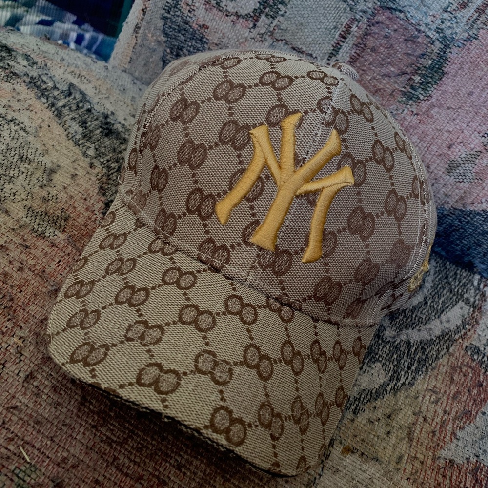 Tan NY hat with gold letters